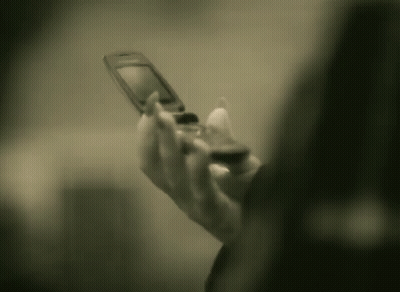Person Holding Flip Phone GIF