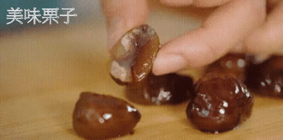 Person Holding Food With Chinese Writing GIF