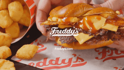 Person Holding Freddy's Sandwich