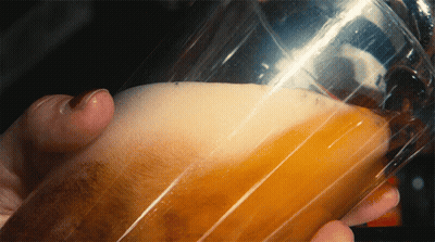 Person Holding Glass Of Beer With Foam GIF