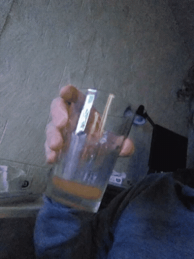 Person Holding Glass Sticker Saying I'm GIF