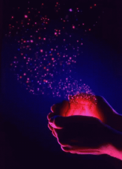 Person Holding Glowing Object In Dark GIF