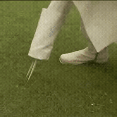 Person Holding Golf Club On Tee GIF