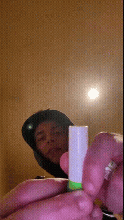 Person Holding Green And White Tube GIF