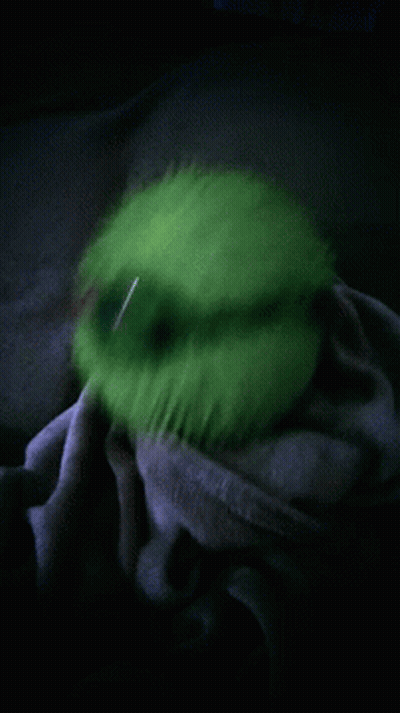 Person Holding Green Ball In Dark GIF