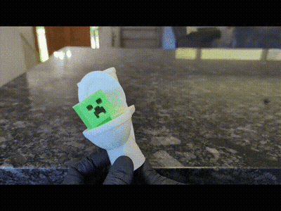 Person Holding Green Creeper In Toilet GIF