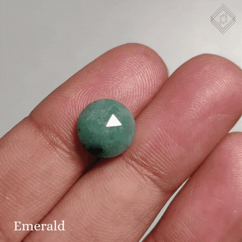Person Holding Green Emerald