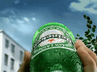 Person Holding Green Heineken Bottle GIF