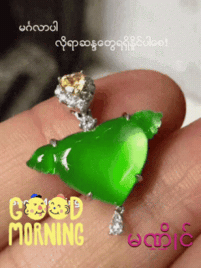 Person Holding Green Pendant Saying Good Morning GIF