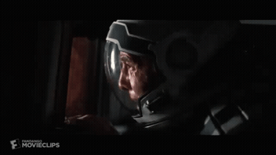 Person Holding Gun In Dark Room GIF