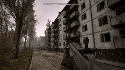 Person Holding Gun In Front Of Abandoned Building GIF