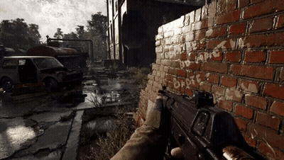 Person Holding Gun In Front Of Brick Wall With Graffiti GIF