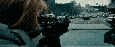 Person Holding Gun In Front Of Van GIF
