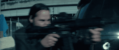 Person Holding Gun With Bullet Hole In Back GIF