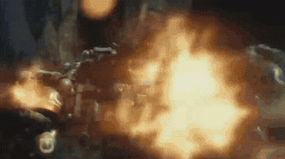 Person Holding Gun With Flames GIF