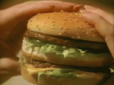 Person Holding Hamburger GIF