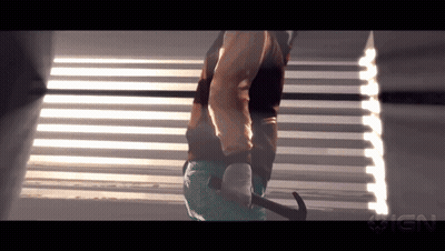 Person Holding Hammer In Front Of IGN Logo GIF