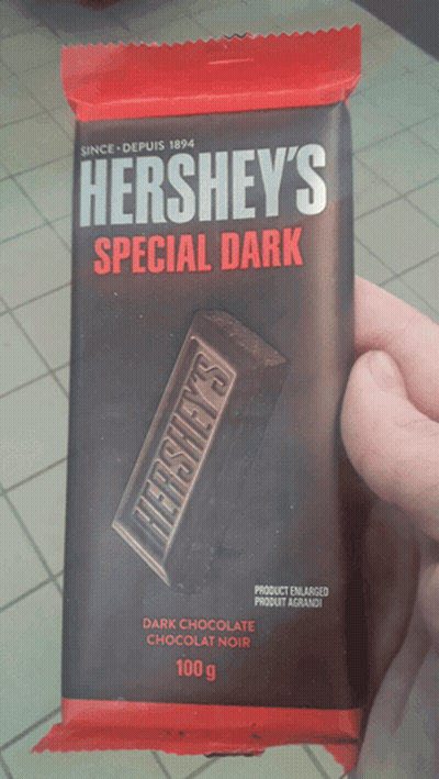 Person Holding Hershey's Special Dark Chocolate GIF