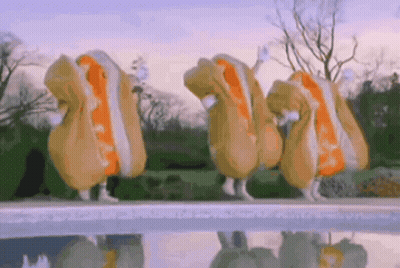 Person Holding Hot Dog In Front Of Grill Saying What Are You Putting On Your Wiener GIF