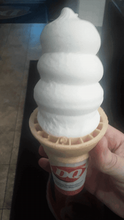 Person Holding Ice Cream Cone With DQ Logo GIF