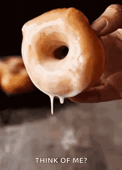 Person Holding Iced Donut With Think Of Me GIF