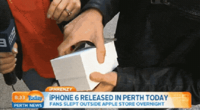 Person Holding iPhone 6 Release Box in Perth