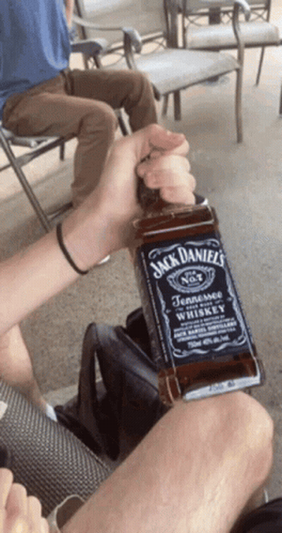 Person Holding Jack Daniels Bottle GIF
