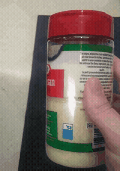 Person Holding Jar Of Sesame Seeds GIF