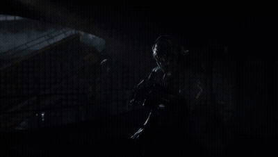 Person Holding Kastov782 Voltspire Rifle In Dark Room GIF
