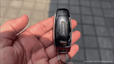 Person Holding Key Saying E-Tron GIF