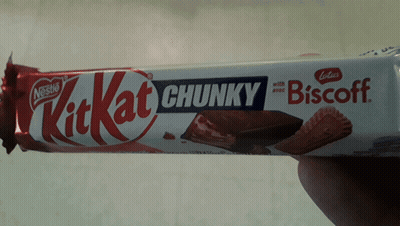 Person Holding KitKat Chunky Biscoff Candy Bar GIF