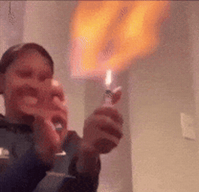 Person Holding Lighter With Flame GIF