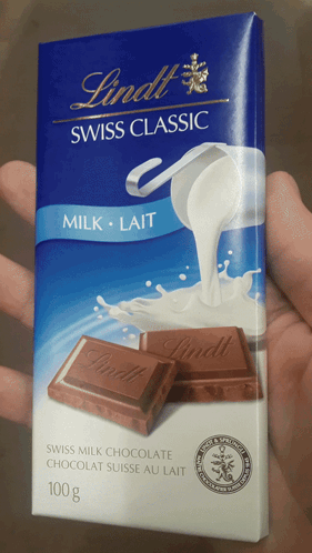 Person Holding Lindt Swiss Milk Chocolate GIF