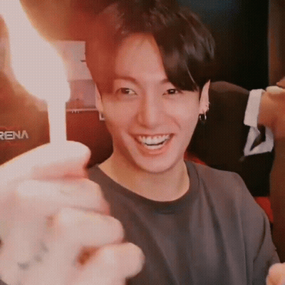 Person Holding Lit Candle Close Up GIF