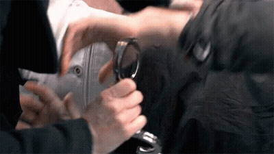 Person Holding Magnifying Glass GIF