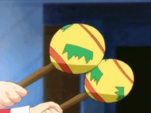 Person Holding Maracas GIF