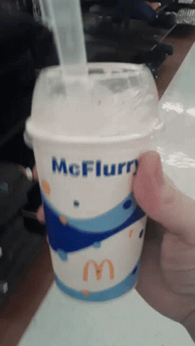 Person Holding McFlurry Cup