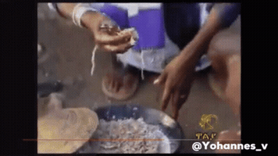 Person Holding Meat In Front Of Pan GIF