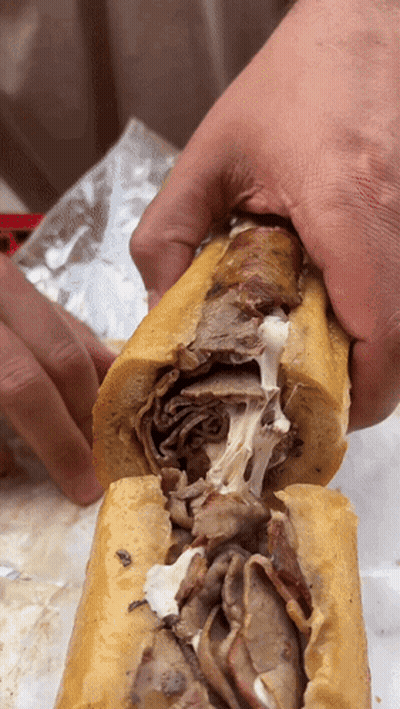 Person Holding Meat Sandwich GIF