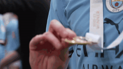 Person Holding Medal Saying Winner GIF