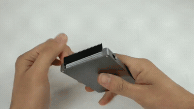 Person Holding Metal With Black Stripe GIF