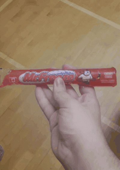 Person Holding Mr. Freeze Cereal Bar GIF