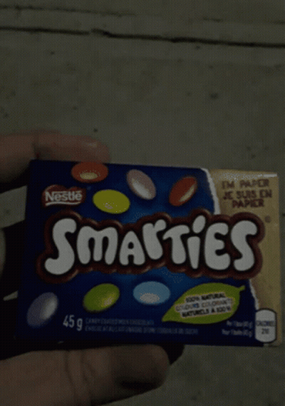 Person Holding Nestle Smarties Box GIF