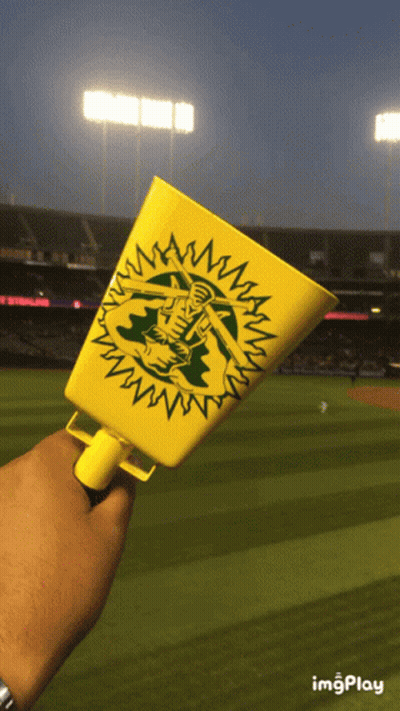 Person Holding Oakland Cup At Baseball Field GIF