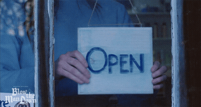 Person Holding Open Sign
