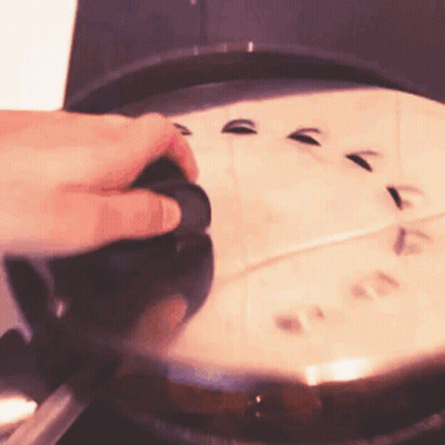 Person Holding Pan Lid On Stove GIF