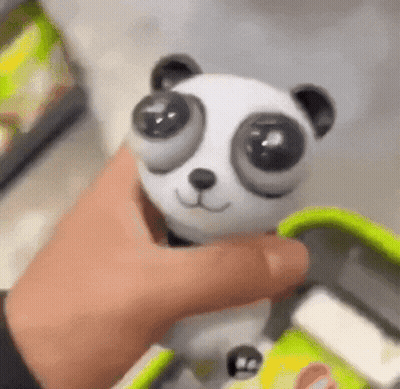 Person Holding Panda Toy GIF
