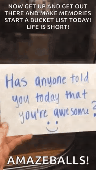 Person Holding Paper With Smiley Face GIF