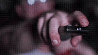Person Holding Pause Button Remote GIF