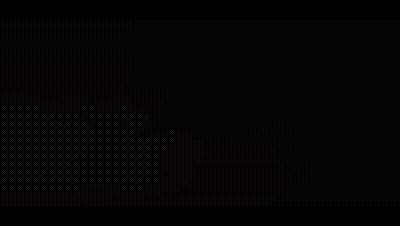 Person Holding Pen In Mouth With Bright Light GIF